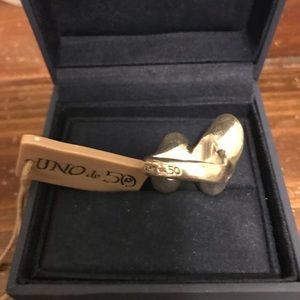 Uno de 50 multi stone ring.